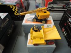 Two Dinky Supertoys diecasts, 562 Dumper Truck in yellow with driver and 571 Coles Mobile Crane in