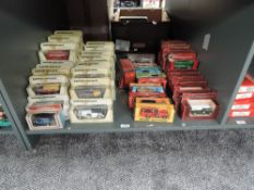A shelf of Matchbox Models of Yesteryear diecasts, in straw, red and mixed colour display boxes,