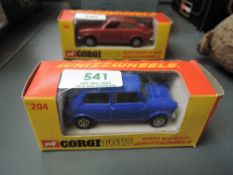A Corgi Toys Whizz Wheels diecast, 204 Morris Mini minor 1.8 in dark blue with cream interior, in