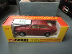 A Corgi Toys Whizz Wheels diecast, 306 Morris Marina 1.8 Coupe in red with cream interior, in