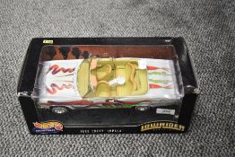 A Mattel Hot Wheels 1:18 scale diecast, Low Rider 1965 Chevy Impala, in original box