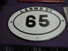 A L&NWR Co oval Bridge Plate 65, Cowan Bridge Lancashire, in white with black lettering, numbering
