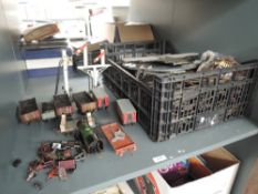 A shelf of 0 gauge including Hornby clockwork 0-4-0 Loco, Carriages and Wagons along with track,