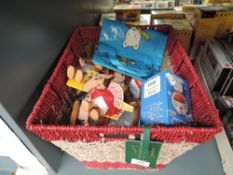 A modern wicker basket containing two modern Steiff Macki and Mucki Hedgehogs both with yellow