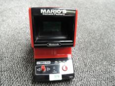 A Nintendo Table Top Game & Watch, Mario's Cement Factory, battery operated, serial number 70115867