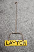 A Railway Track Line Hanging Enamel Sign, Layton, in yellow with black lettering and border,