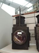 A Railway Lamp having front and rear bulls eye lens and carry handle, no marking seen, height