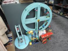 A collection of Meccano including Traction Engine, Crane, Ferris Wheel and two wooden Sickocks