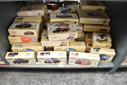 A shelf of Corgi Classics diecast Buses and Advertising Vans, all boxed, approx 40+
