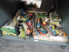 A shelf of modern Tin Plate Toys including clockwork Trains with Tracks, Cars, Animals etc, some