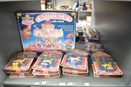 A shelf of Matchbox Carousel Collection, 4460 Musical Carousel, 12 Horses include 74620 Tpaz,