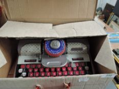A Mettoy Elegant tin plate Typewriter, in original box