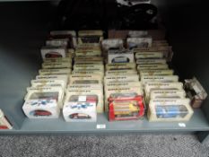A shelf of Lledo Models of Yesteryear and similar diecasts, all boxed, approx 60