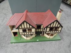 A 1930's Lines Triang wooden two storey Dolls House having two bedrooms, dinning room, hallway and