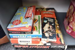 A collection of vintage games including Parker Super Striker, Peter Pan Headache, Mastermind,