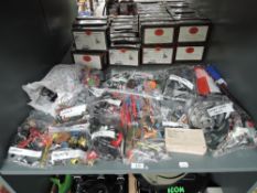 A shelf of plastic spare parts, limbs, weapons etc including Marvel Star Wars etrc
