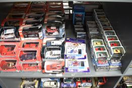 A shelf of mixed scale Cararama diecasts, all boxed approx 120+