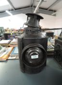 A LMS Railway Adlake Non Sweating Lamp having single bulls eye lens, height including handle 47cm