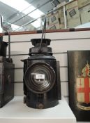 A LMS Railway Adlake Non Sweating Lamp having single bulls eye lens, height including handle 47cm