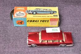 A Corgi diecast, 247 Mercedes Benz 600 Pullman in dark red with white interior, in original box