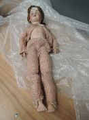 An early 20th century Armand Marseille/Simon Halbig style bisque headed Doll having sleep eyes