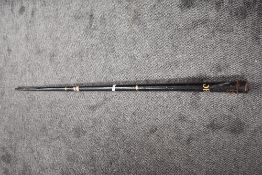 A vintage EJ Riley Limited one piece Snooker Cue having impressed number 69933, in tin storage tube