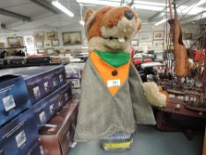 A Basil Brush Glove Puppet in traditional dress