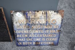 A BR cast and enamel Warning Notice, Gates Must Not Be Opened Until It Has Been Ascertained That The