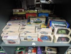 A shelf of Corgi diecasts including Classics, Super Heroes, The Times Classics, Whitbred etc, all