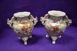 A pair of reproduction Japanese Koro decorated in a Satsuma style.