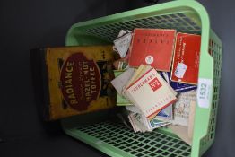 A box of cigarette cards and a vintage Radiance Toffee tin.
