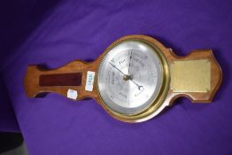 A 1970's Comitti of London barometer, with attached BADMCC 1970 trails plaque