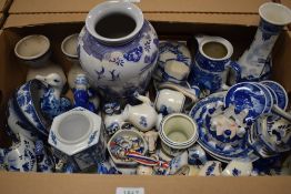 A large shelf full of vintage Dutch Delft wares and similar blue and white wares.