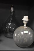 Two modern hand blown glass lamps including a mottled glass ball and tear drop design.
