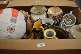 A box of mixed stoneware and ceramics, to include hot water bottle, character jugs, brass