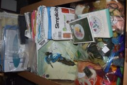 A lovely craft collection including dress patterns, cross stitch kits and tapestry wool etc.