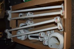 A selection of matching toilet ceramics including towel rails, soap dishes and roll holders.