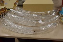 Four antique cut glass horn shaped vessels, having etched detail, possibly formally part of an