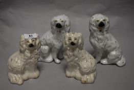 Four 20th century Staffordshire style dogs.