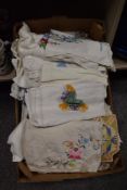 A box full of vintage and retro table linen, some nicely embroidered examples amongst this lot.