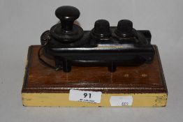 A WW2 Bakelite Morse code key.