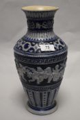 A 19th century Rhenish pottery vase, having relief Cherub, motifs and Greek key decoration, AF