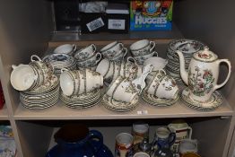 A large collection of Johnson Bros 'Indian Tree' cups, saucers, plates, coffeepot and bowls.