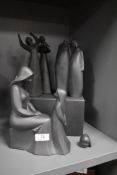 Four Royal Doulton black Basalt figure studies including Awakening, Mother and Daughter, Other two