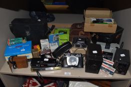 A collection of vintage cameras, flashes and accessories, makes such as Agfa, Nova and Halina