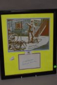 A Framed Norman Wisdom postcard with facsimile signature card underneath.