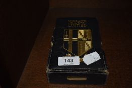 A vintage Midland bank limited money box in the form of a book, with cardboard box.