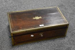 An early Victorian large sized writers slope having Rose wood and brass banded case with hidden