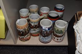 Nine collectable steins, having Christmas scenes to each.