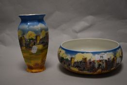 A 1930s fruit bowl and a vase, both depicting beefeaters and castle scene, marked NHP to underside.